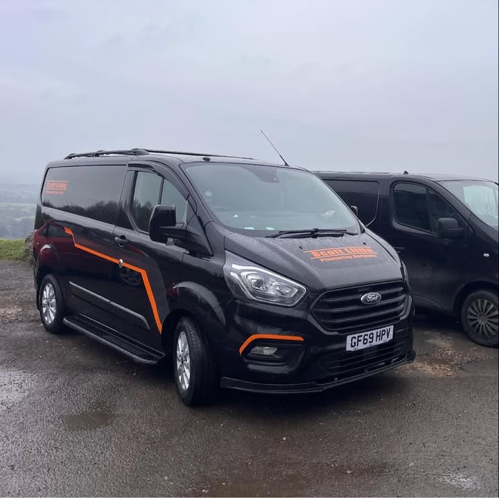 Our current black van with orange Scott Little Plastering Services livery
