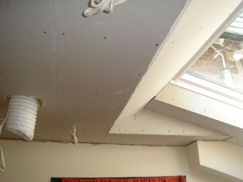 Ceiling around a skylight boarded out