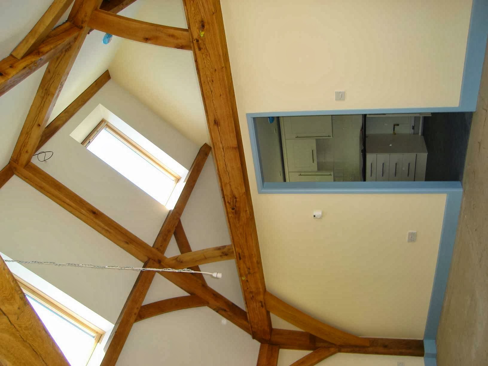 Finished vaulted ceiling with oak beams and roof windows