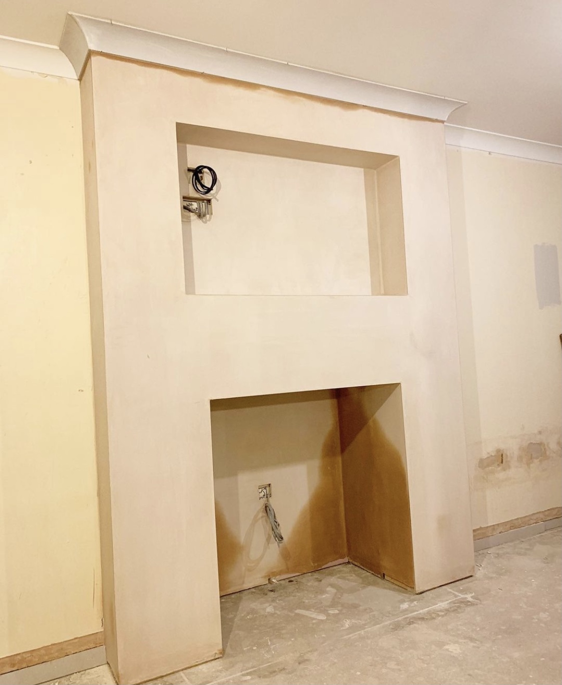 Plastered chimney breast and fireplace surround