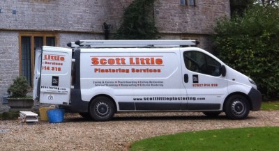 An earlier Scott Little Plastering Services van outside a stone house