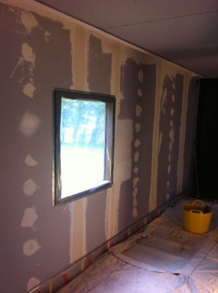 A dry-lined wall, before