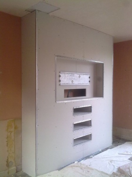 A studwork fireplace, before