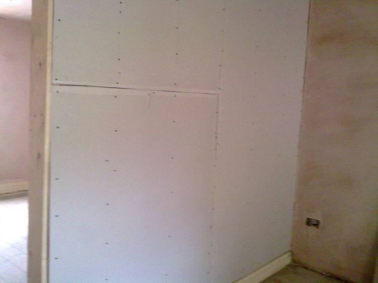 Plasterboarding the stud wall