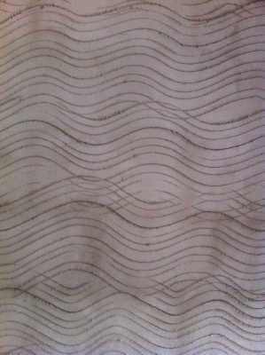 Keyed scratch coat on a wall