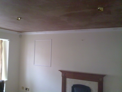 A finished room with a fireplace